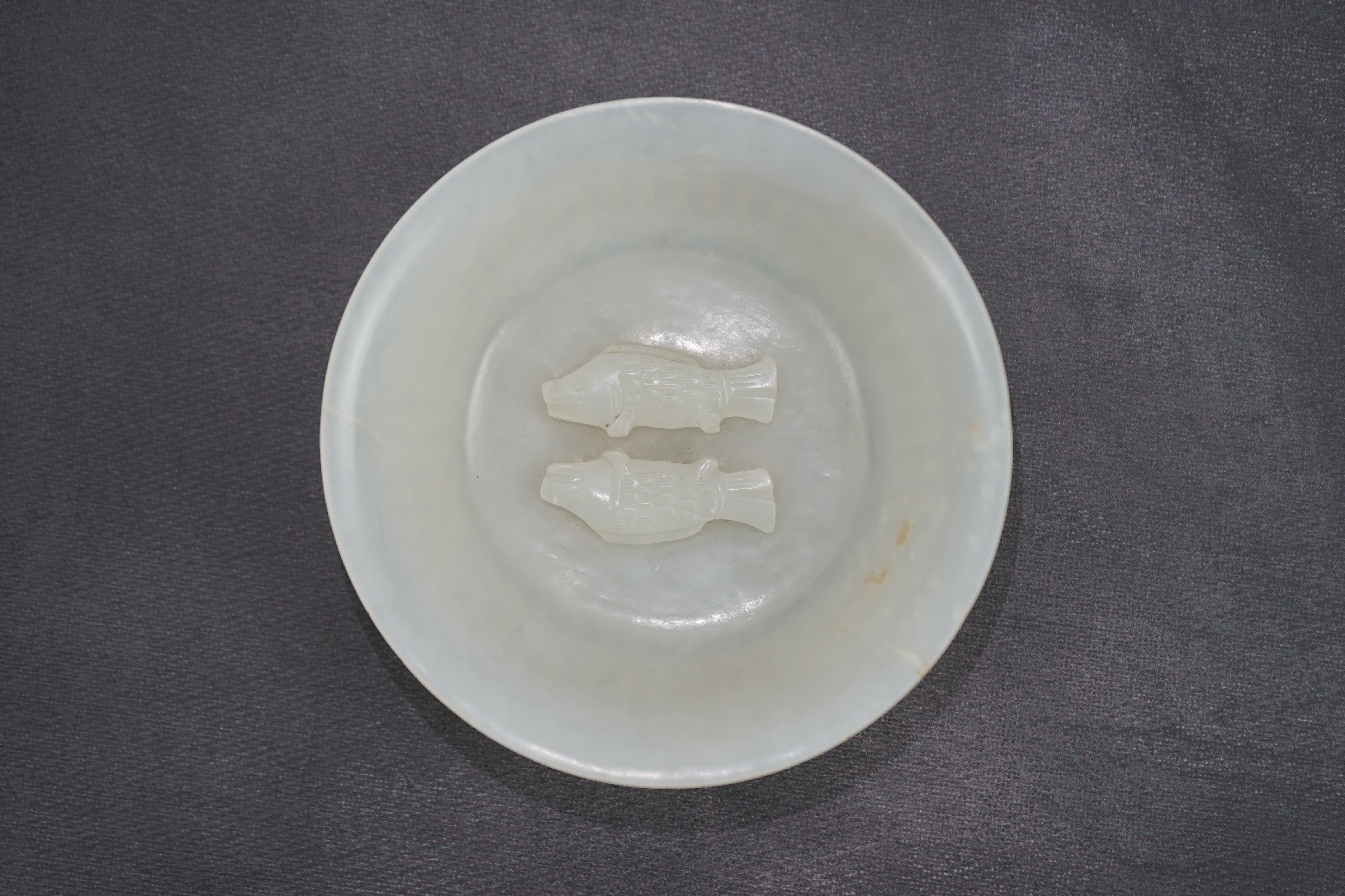 A fine Chinese white jade 'twin-fish' bowl, Qianlong period (1736-95)